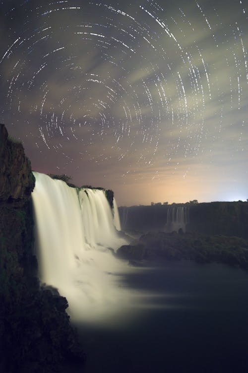 Reflections on Sky over Waterfalls in Evening