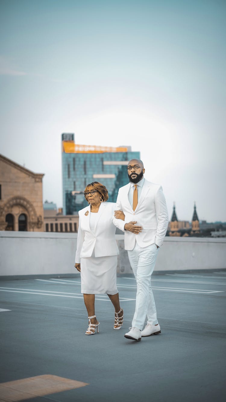 Man And Woman In Formal Clothing