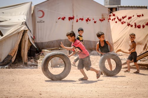 
Children Playing with Tires