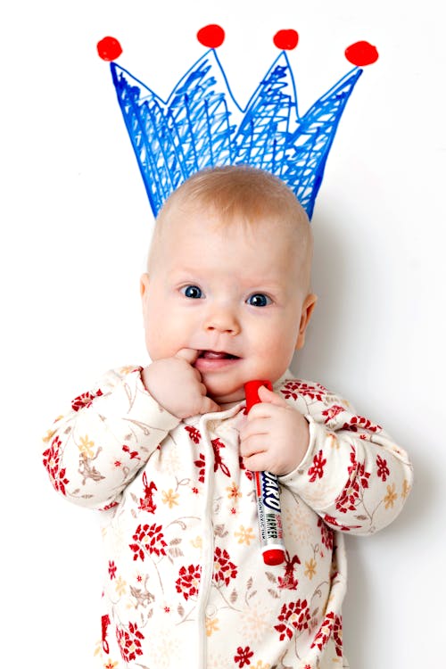 Free Baby in White and Red Floral Pajama Stock Photo