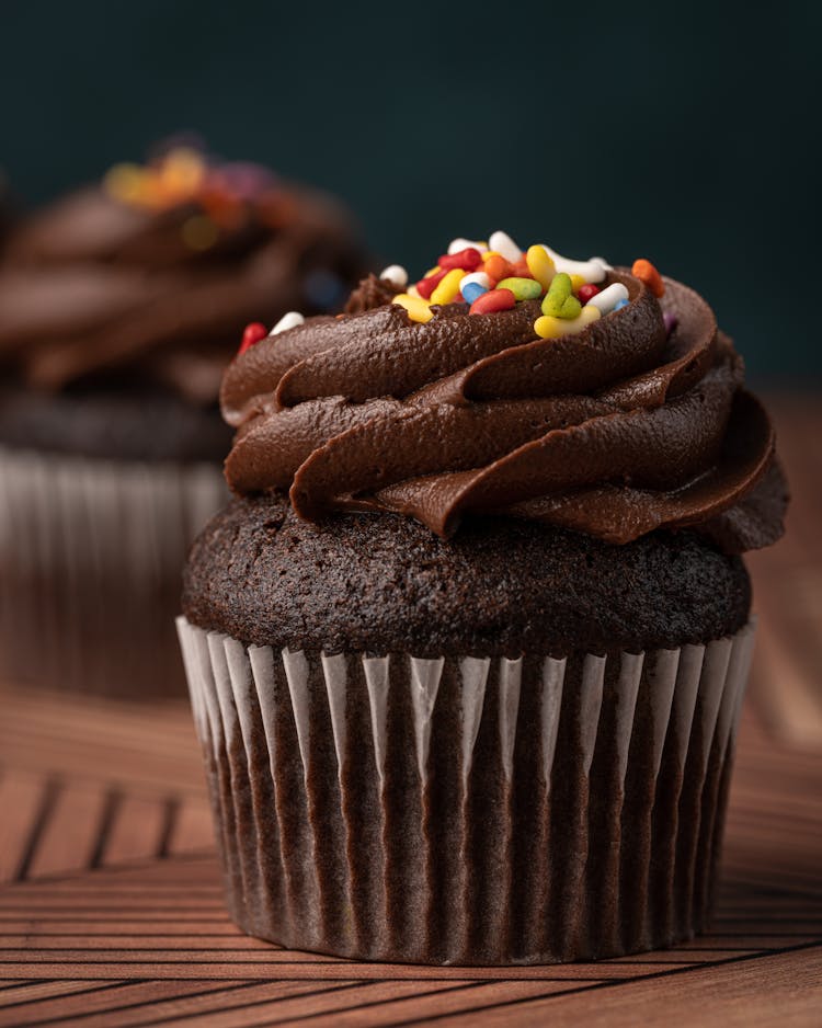 A Chocolate Cupcake With Sprinkles 