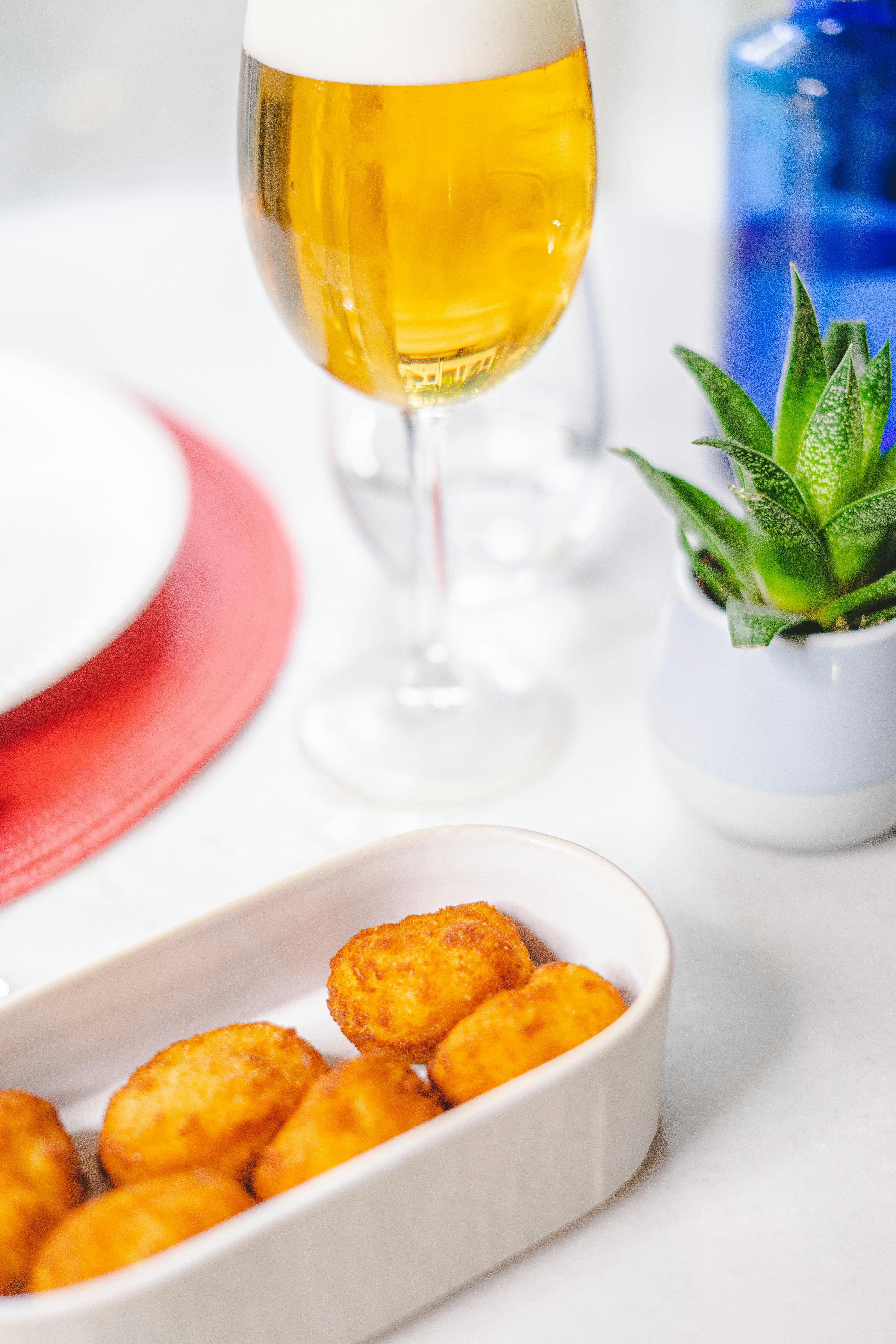 Tater Tots Served in Bowl with Glass of Beer · Free Stock Photo