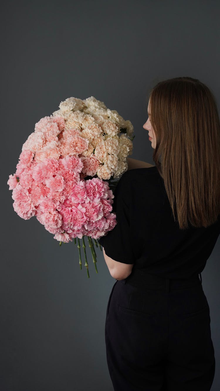 Woman Holding Big Bouquet Of Pink Flowers