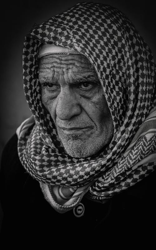 Grayscale Photo of an Elderly Man in a Keffiyeh