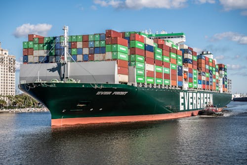 Free Green Cargo Ship on Body of Water Stock Photo