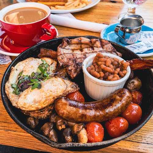 Mushrooms and Tomatoes Beside the Sausage 