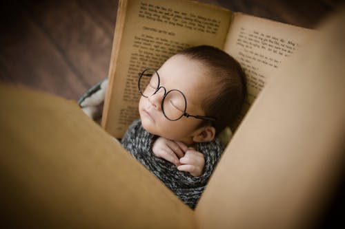 Free A Baby Sleeping While Wearing Eyeglasses  Stock Photo