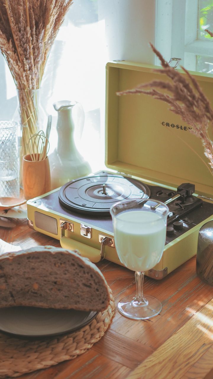 two-tiered lazy susan turntable holding coffee syrups, creamer, and stirrers