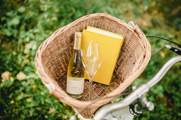 Wine, Glass And Book In Basket