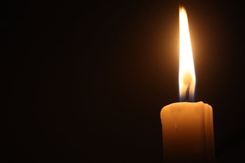 Lighted Candle in Close-up Photography