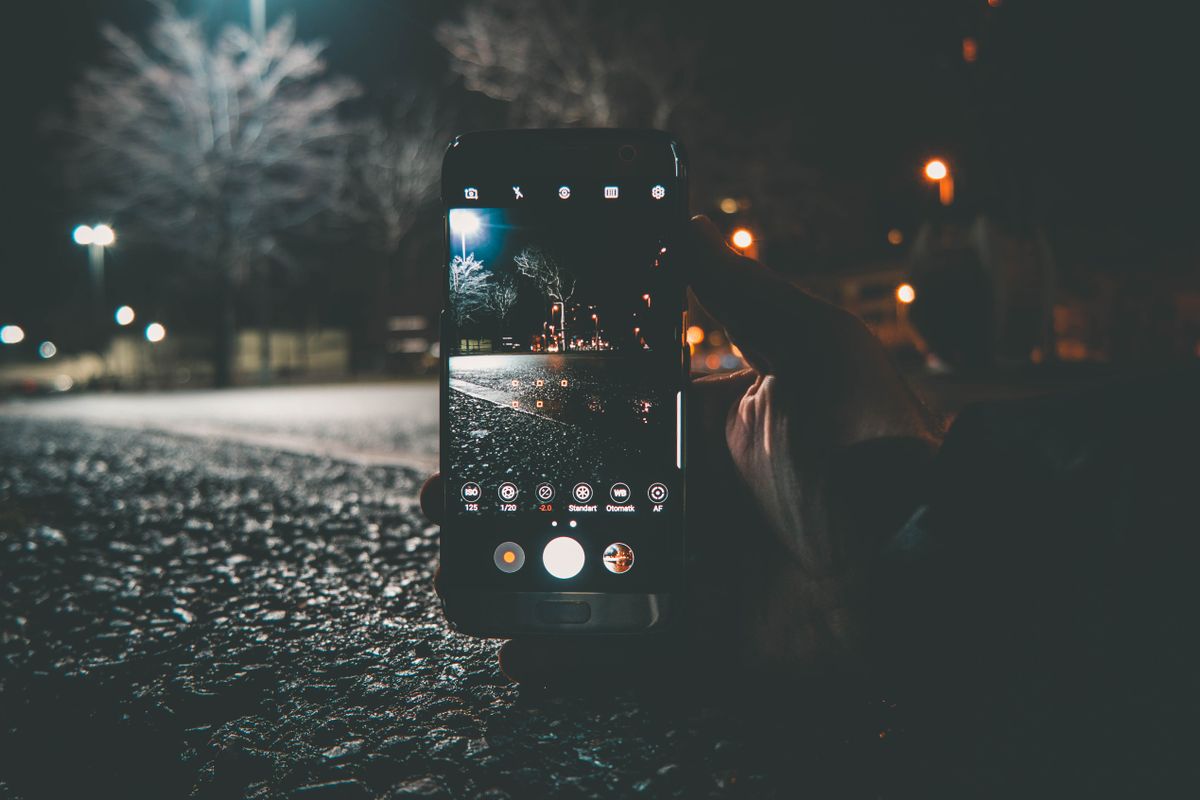 A phone lying face up with the screen on