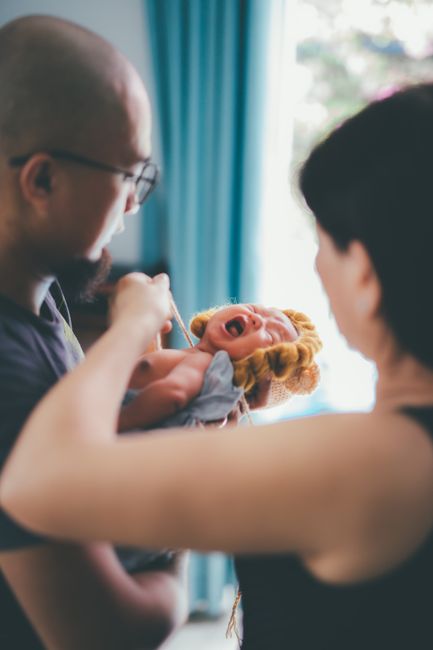 newborn baby with parents at home