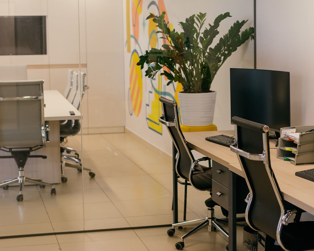 Workstation run with ergonomic chairs and a colourful feature wall
