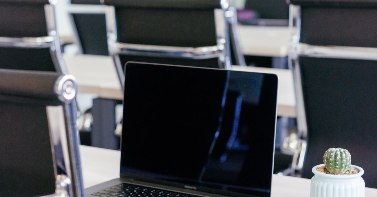 Macbook Pro on White Table · Free Stock Photo