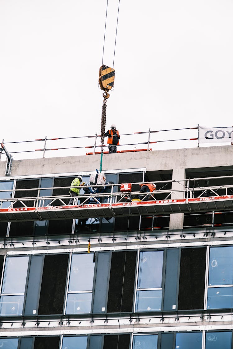 Workers On Lift