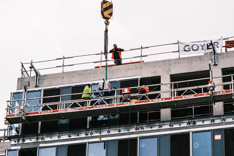 Labourers On Lift