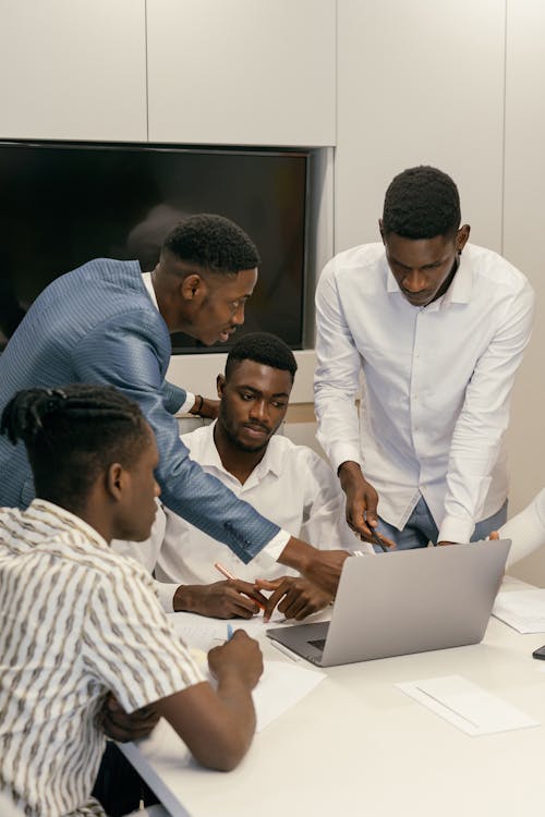 Free Group of Men in White Dress Shirt Using Laptop Computers Stock Photo