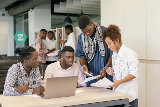 A diverse team collaborating on a project in a modern office environment.