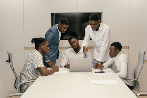 Businessmen Brainstorming in a Business Meeting