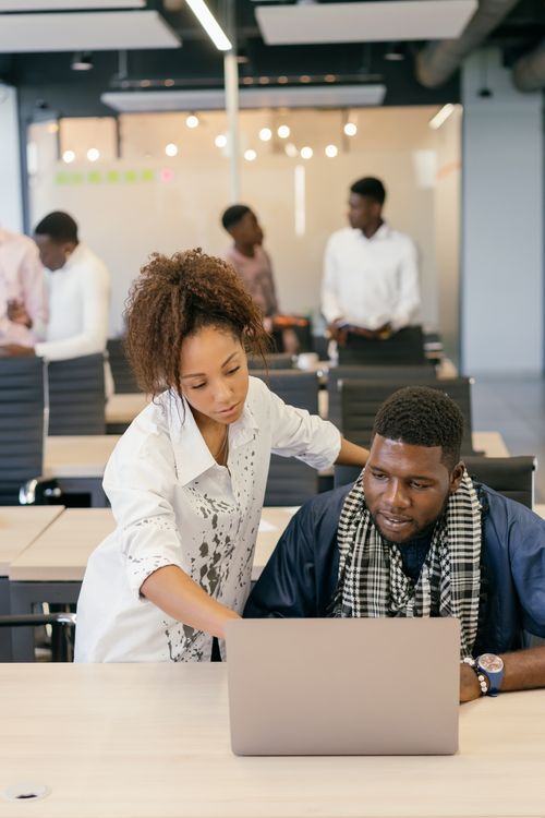 Free A business team collaborating on a project in a modern office setting. Stock Photo