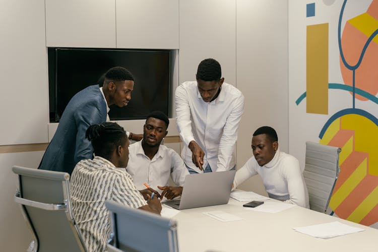 A Group Of Men Having A Discussion