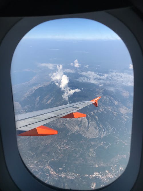 Scenic View of Mountains from an Airplane Window
