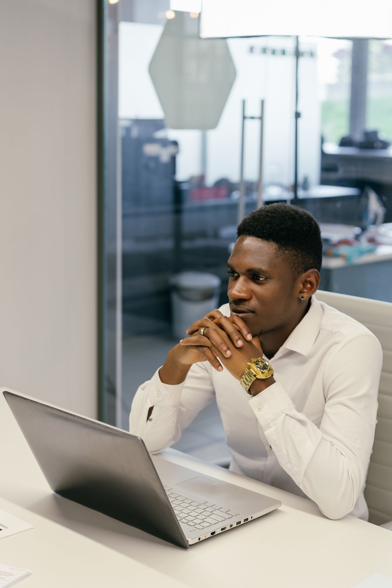 An African professional focused and preparing at a desk