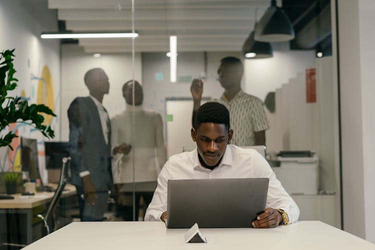 Man Working Alone On A Laptop 