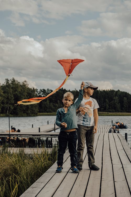 Boys Standing on a Boardwalk