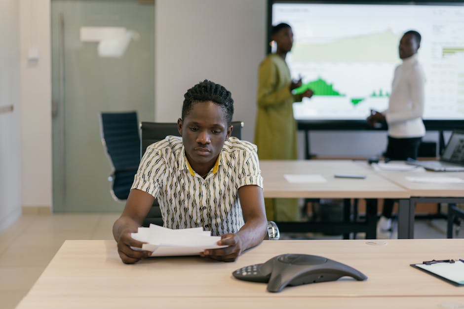 Business professionals analyzing data in a contemporary office environment.