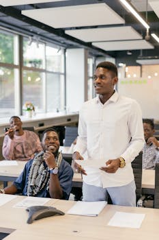 African American colleagues brainstorming in a modern office setting. Professional business environment.