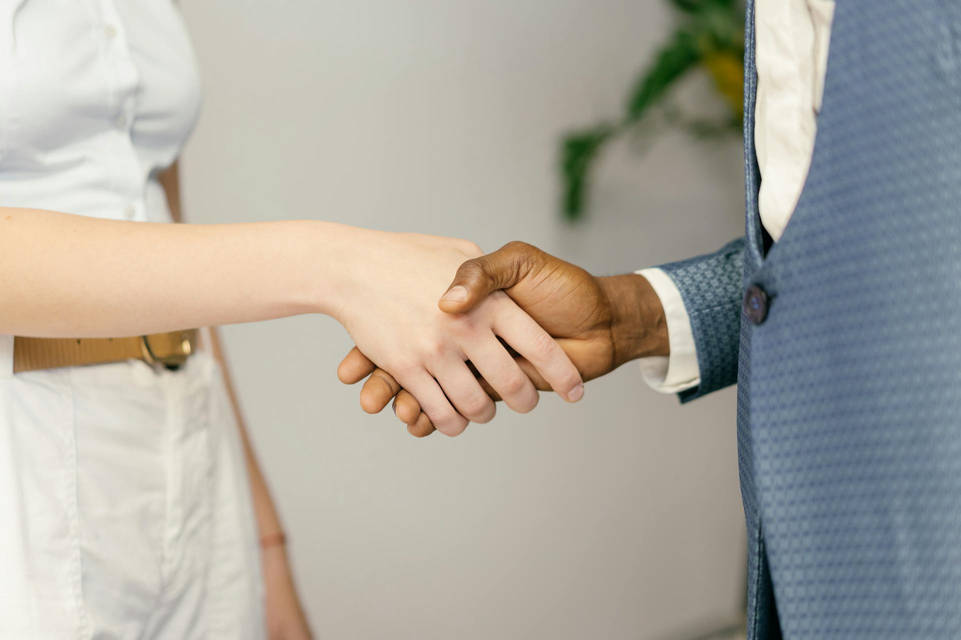 Close-up of a professional handshake symbolizing agreement and partnership in business.