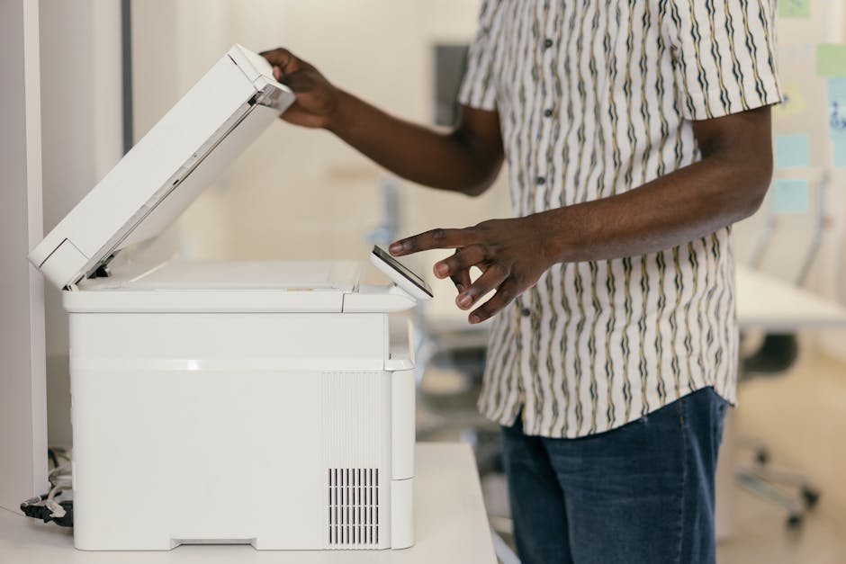 A person using a copy machine - how to use copy machine A person using a copy machine - how to use copy machine