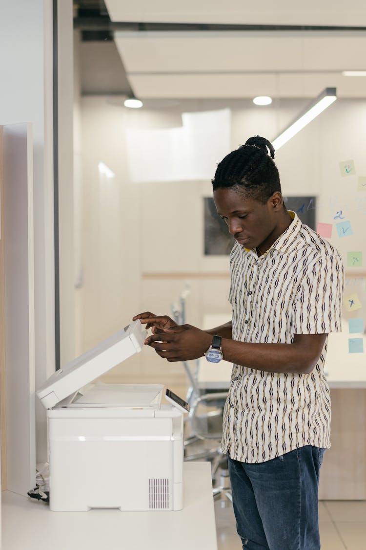 Man In The Office Using A Scanner