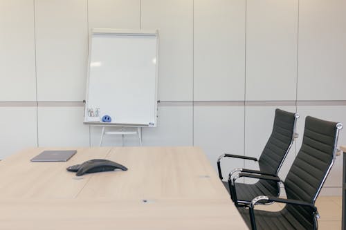 Free A Blank Whiteboard Inside the Conference Room Stock Photo