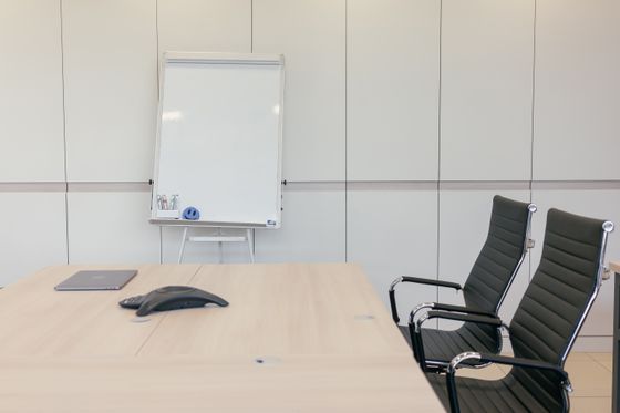 Empty boardroom with a long table — photo by Mikhail Nilov on Pexels