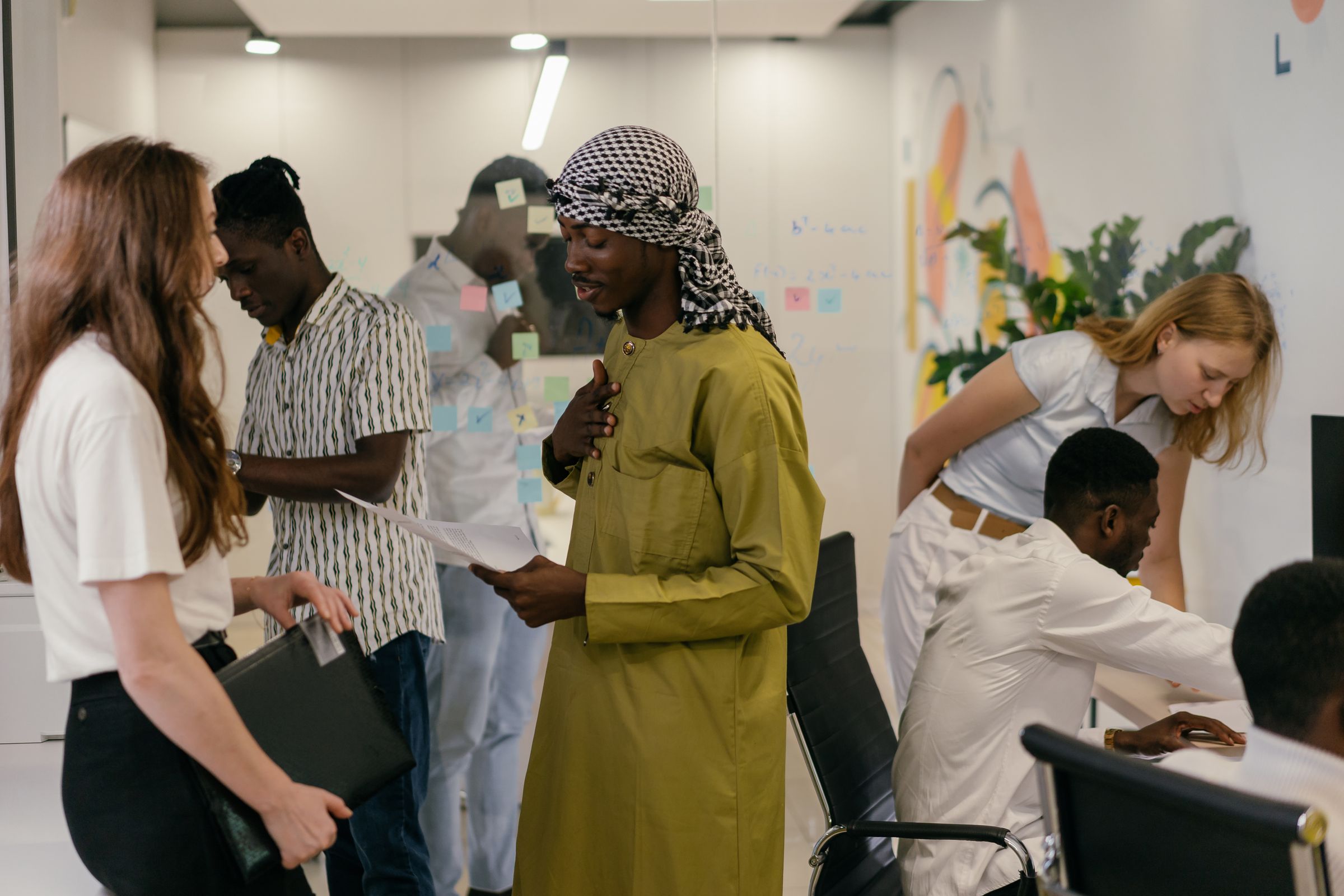 A diverse group of investment professionals collaborating in an office