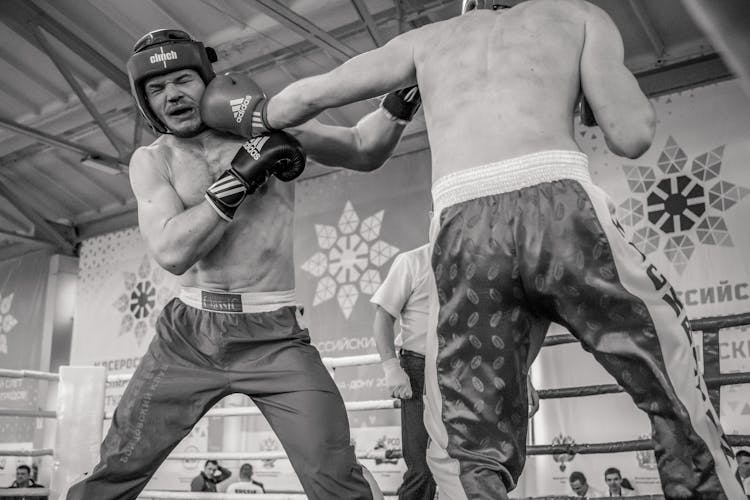 Men Fighting In The Ring 