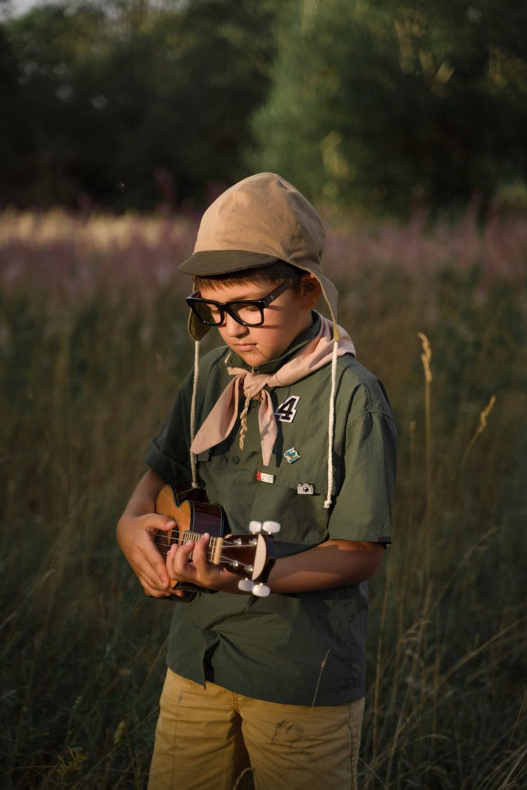 A Boy Playing Ukulele