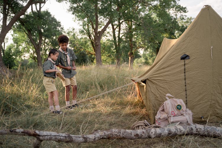 Photo Of Kids Setting Up A Tent