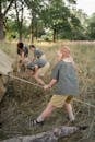 Man in Gray T-shirt Holding a Rope
