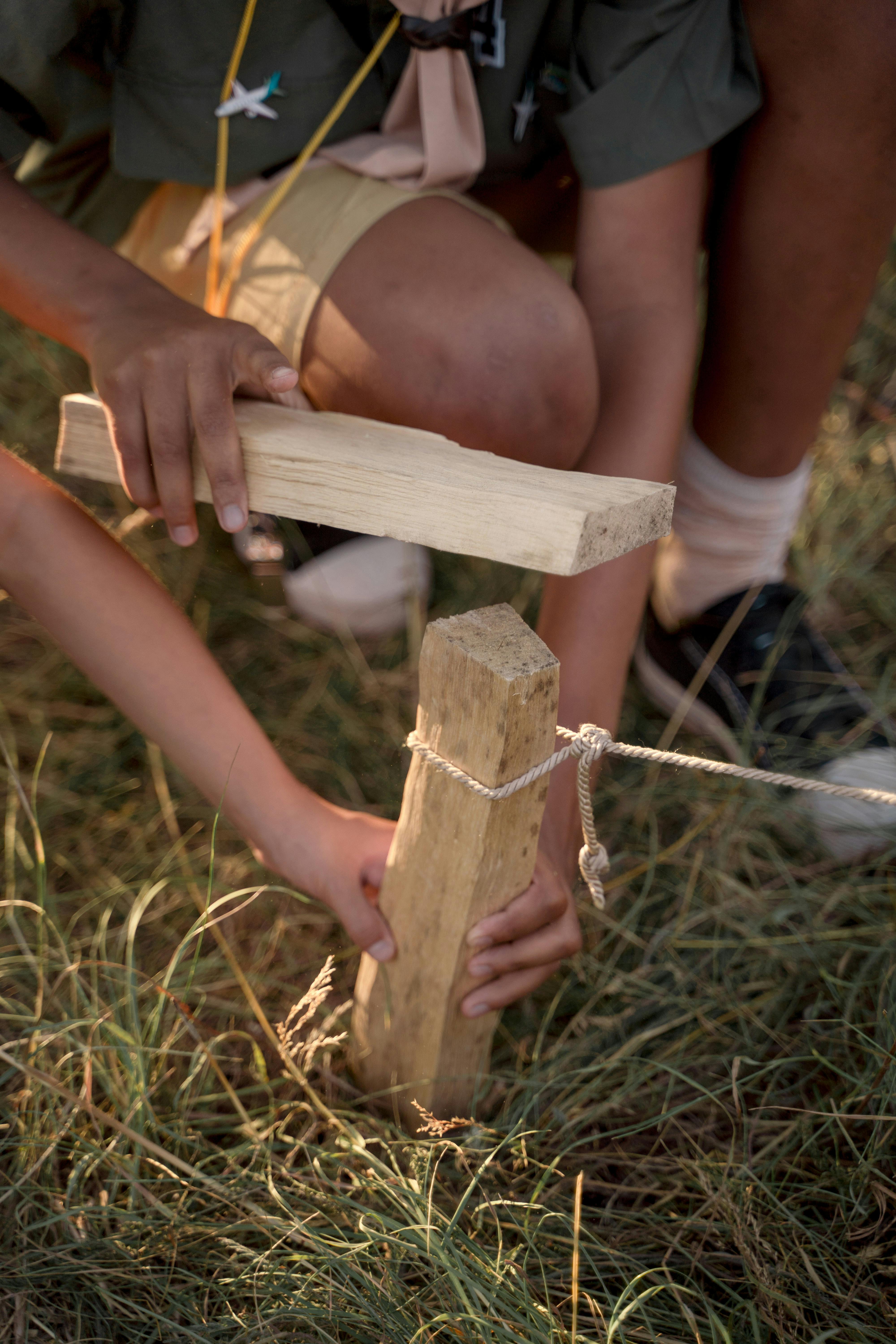 scouts planting wood in the ground