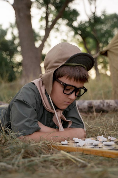 A Boy Playing a Board Game