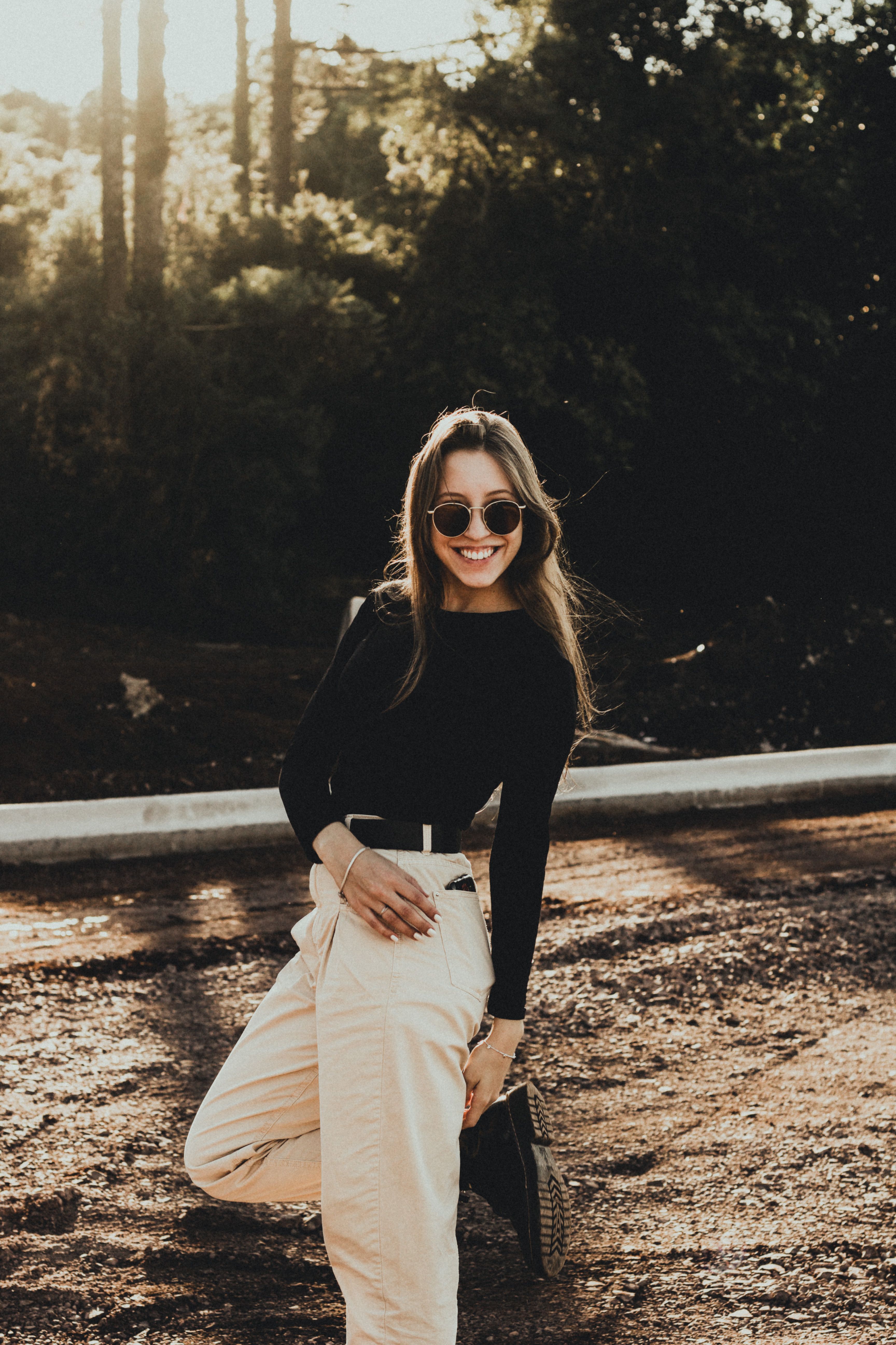 Woman in black long-sleeve shirt with sunglasses