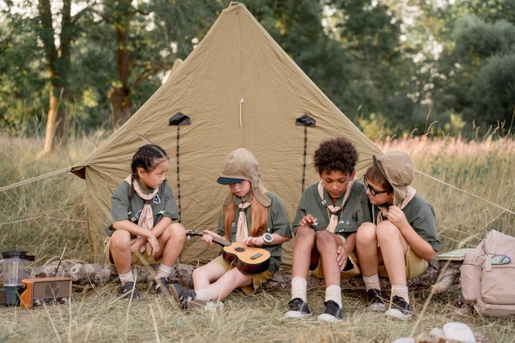 Multiracial Kids Sitting Beside Tent