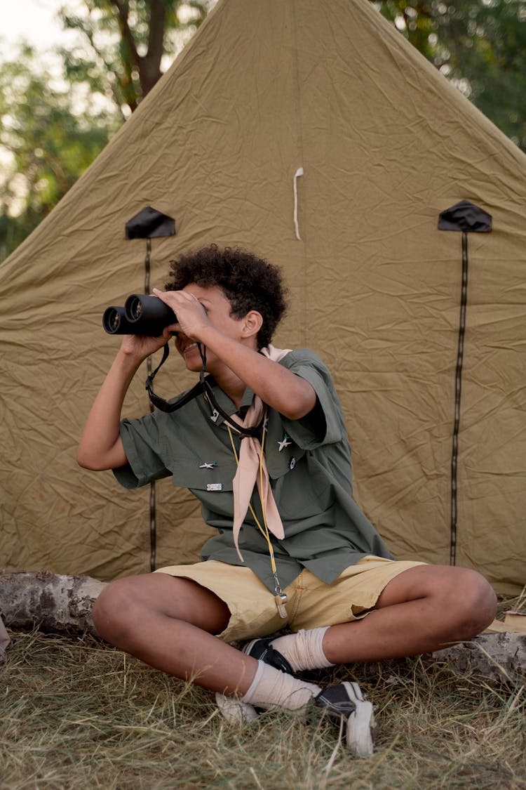 Boy Holding Binoculars
