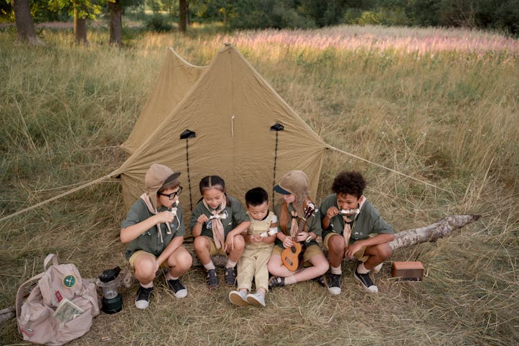 Young Scouts Eating Skewered Marshmallows