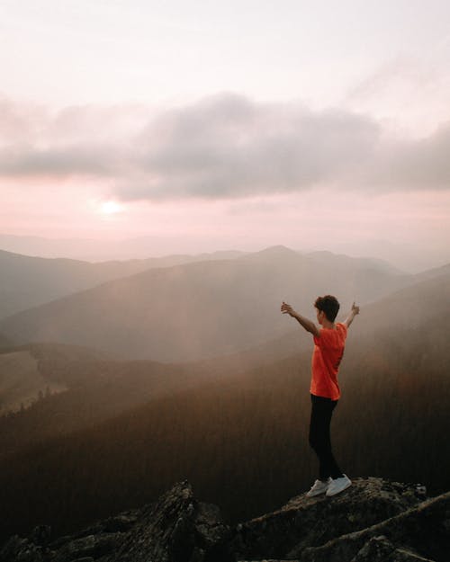 Man Standing on Rock