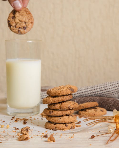 Free Stack of Cookies Beside a Drinking Glass With Milk Stock Photo