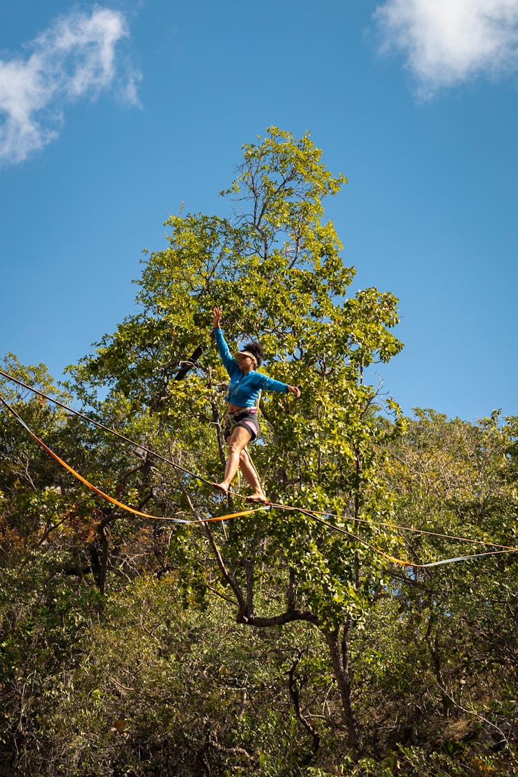 Woman In A Rope Park In Forest 